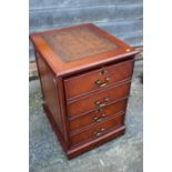 A mahogany two-drawer filing cabinet with tooled leather lined top, 21" wide x 24" deep x 31" high