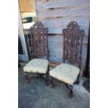 A pair of Victorian carved side chairs of early 17th century design, on turned supports united by an