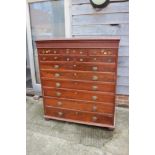 A mahogany cabinet of drawers, fitted three small, two shallow and seven graduated long drawers,