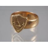 An 18ct gold shield-shaped signet ring, size G/H, 3.7g