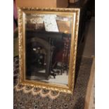 A gilt framed wall mirror with bevelled plate, 19" x 28"