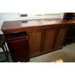 A 19th century mahogany bookcase enclosed four panelled doors, on block base, stamped J Campbell,
