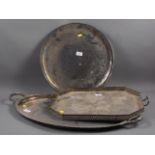 A silver plated two-handled tray, a plated gallery tray, two plated circular trays and two brass