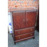 A Stag Minstrel two-door wardrobe, fitted one drawer, on bracket feet, 38" wide x 24" deep x 69 1/2"