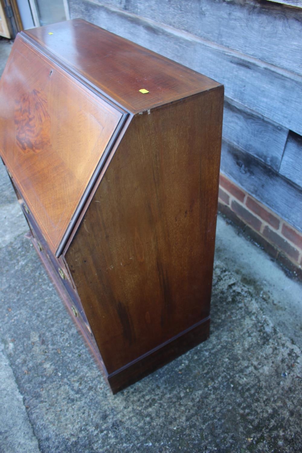 An Edwardian mahogany and satinwood banded fall front bureau with fitted interior over three long - Image 3 of 4