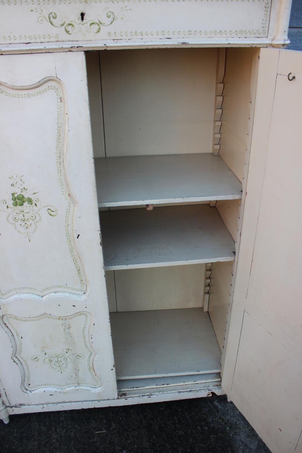 A Continental painted cupboard enclosed two doors, on turned supports, 38" wide x 18 1/2" deep x - Image 2 of 3