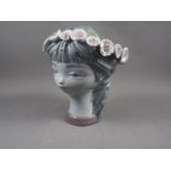 A Lladro porcelain girl's head, model number 1865 Vincent Martinez, 11 1/4" high (cracks to handle)