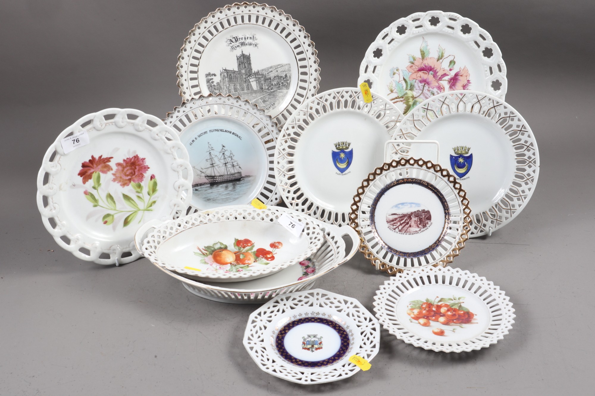 A collection of late 19th century ribbon plates, various designs