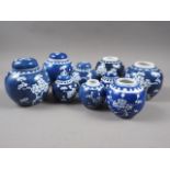 Nine Chinese blue and white ginger jars, various sizes, all with double ring marks to bases,
