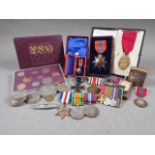 An Imperial Service Order, in fitted box, a matching miniature, a group of WWII medals, various