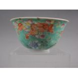 A Chinese famille verte bowl with dragon, coy carp and floral polychrome decoration, four-