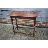 An oak side table on barley twist stretchered supports, 30" wide x 14 1/2" deep x 28" high, and a