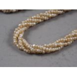 A 19th century seed pearl multi-strand necklace and another similar