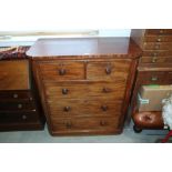 A 19th century figured mahogany chest of two short and three long graduated drawers with knob