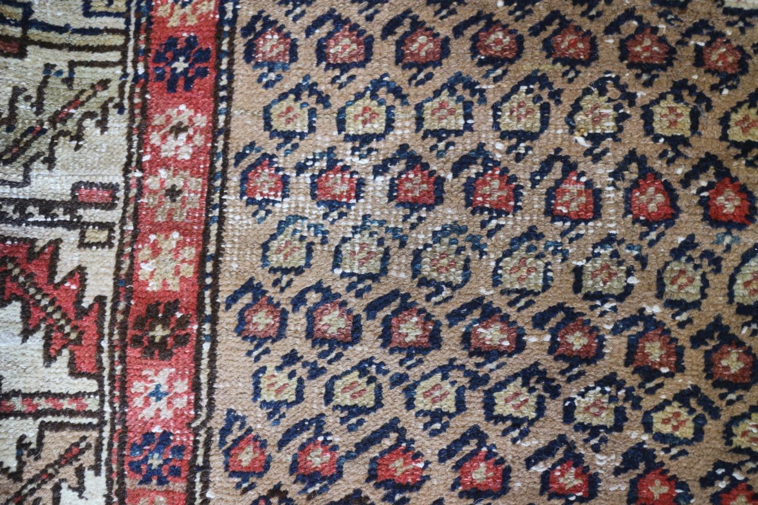 A tribal runner with all-over boteh design on a camel ground and two geometric borders, in shades of - Image 3 of 5