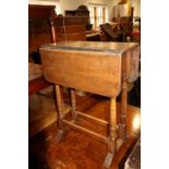 An oak drop leaf occasional table, on turned supports, 18" wide x 22" deep x 22" high, and a