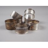 Three matching silver napkin rings and four others, 4.8oz troy approx