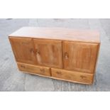 A 1960s Ercol elm 429 sideboard, fitted three doors over two drawers, 52" wide x 18" deep x 30" high