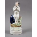 A 19th century Staffordshire figure of a seated sailor praying, 6 1/2" high