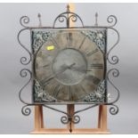 A 19th century clock dial with brass dial, Roman numerals, scrolled wrought iron border and later