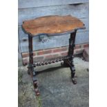 A late 19th century rosewood shape top occasional table, on pierced panel end supports, united by