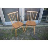 A pair of 1960s Ercol "All Purpose" 391 stick back chairs
