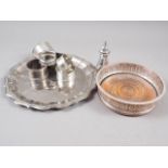 Five silver napkin rings, 3.9oz troy, a silver plated on copper bottle coaster and other plate