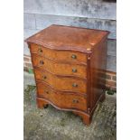 A 1930s burr walnut serpentine front chest of four drawers with ring handles, on bracket feet, 24"