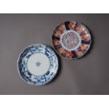 A Japanese blue and white dish with sectioned floral bordered decoration and six-character mark to