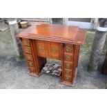 A mahogany sewing machine cabinet, now converted as a desk, fitted two drawers, 34" wide x 18"
