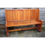 An oak panel end bench/pew, 60" wide x 20" deep x 39" high