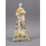 An 18th century Pratt type figure of Ceres, on sponge work decorated base, 8 3/4" high (head