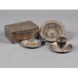 A silver cigarette box (damages), a silver egg cup and two silver pin dishes