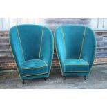 A pair of deep seat arm easy chairs, upholstered in an azure velour with old gold piping, on