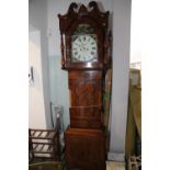 An early 19th century mahogany and banded long case clock with painted dial and striking movement,