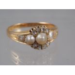 An 18ct gold,  pearl and  diamond dress ring, size O, 3.3g