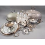 A silver plated six bottle cruet, two meat domes, a plated teapot and other plate