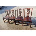 Two pairs of Georgian provincial pierced splat back and panel seat dining chairs