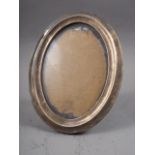 A silver oval easel photo frame, 6 3/4" high