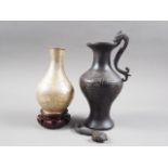 A Chinese bronze vase with engraved decoration (damages) and a gilt metal vase with animal, bird and