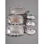 A pair of silver decanter labels, 0.9oz troy approx, a silver plated on copper decanter label and