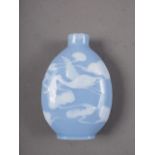 A Chinese blue and white pate sur-pate-snuff bottle with relief crane decoration, 2" high (chip to