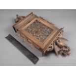 A 19th century carved walnut black forest type letterbox with pheasant surmount, 22" high, and a