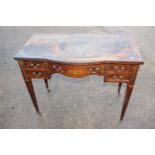 A late 19th century rosewood and inlaid break bowfront writing desk, fitted five drawers, on