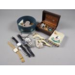 A quantity of commemorative crowns and other coins, gentleman's wristwatches, badges, cufflinks