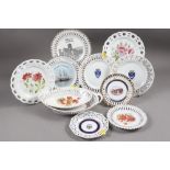 A collection of late 19th century ribbon plates, various designs