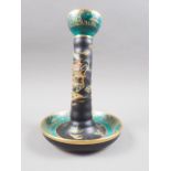 A Carlton ware "Black Japan" style candlestick, 8 3/4" high