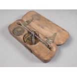 An 18th century brass and steel balance, in fruitwood case, monogrammed WL, case 4 1/2" wide