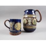 A Royal Doulton stoneware 1902 Coronation jug, 7" high and a companion mug