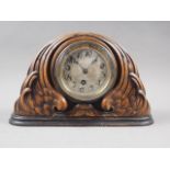 An early 20th century carved oak mantel clock with silvered dial, 7 1/4" high